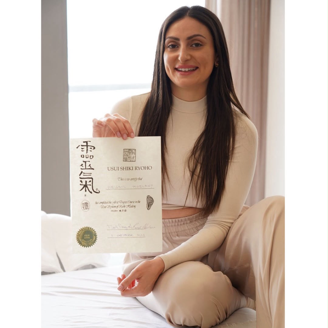 Abigail with her Usui Shiki Ryoho Reiki certificate